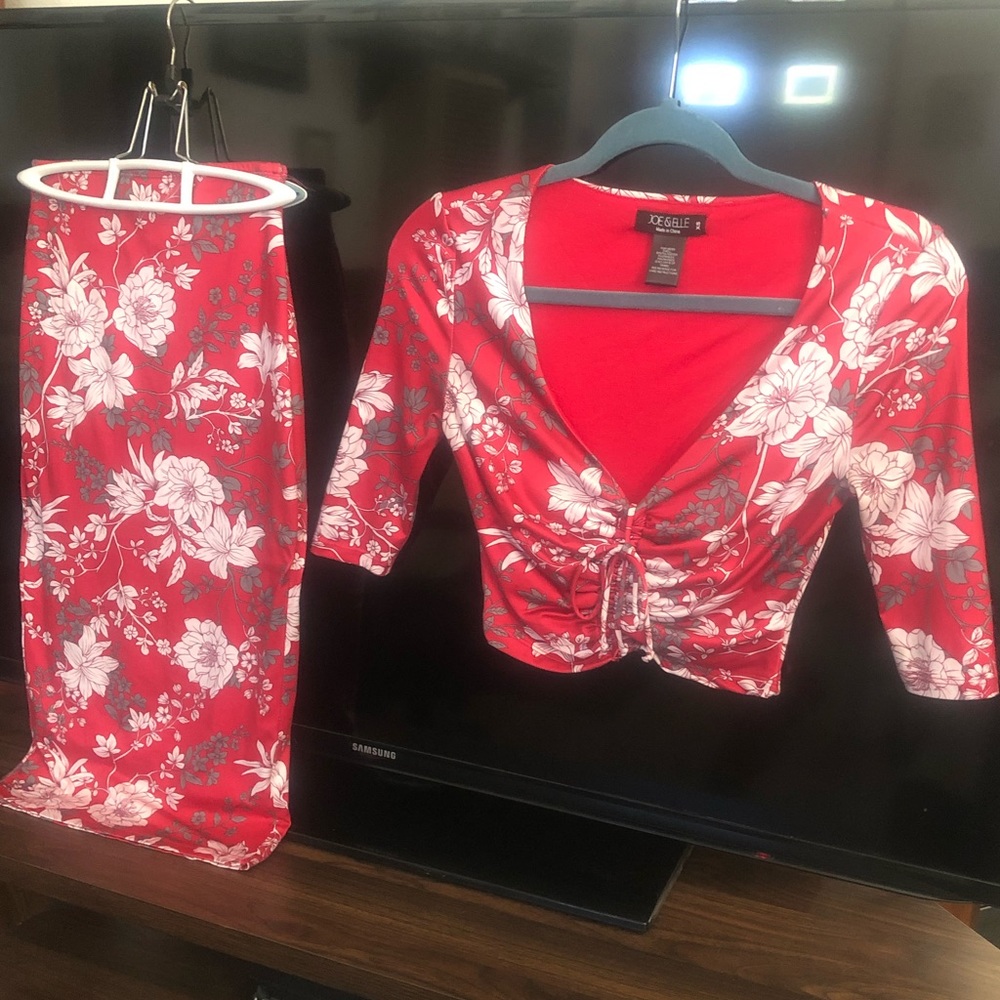 Light red with white and gray floral design shirt and skirt outfit.
